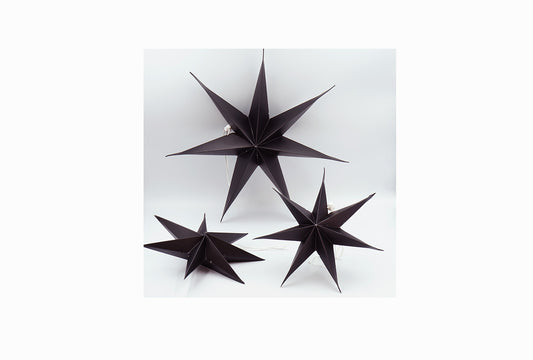 Schwarze 3D-Weihnachtssterne aus Pappe
